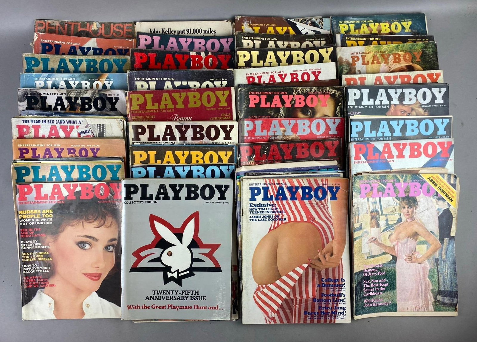 Group of 30+ Vintage Playboy Magazines: Circa 1970s/1980s. Rips and tears throughout. One measures L 11 1/2 x W 8 1/2 inches.