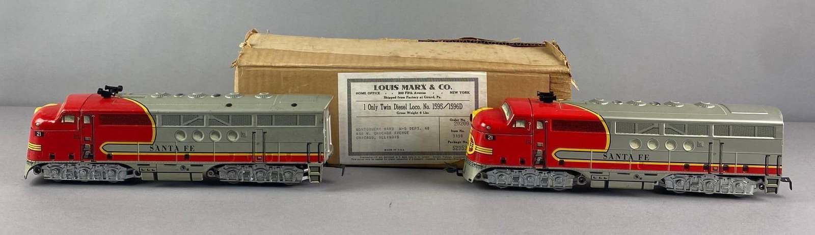 Vintage O Scale R/C Twin Santa Fe Diesel Locomotives: Untested in original box, each locomotive measures 13 inches L