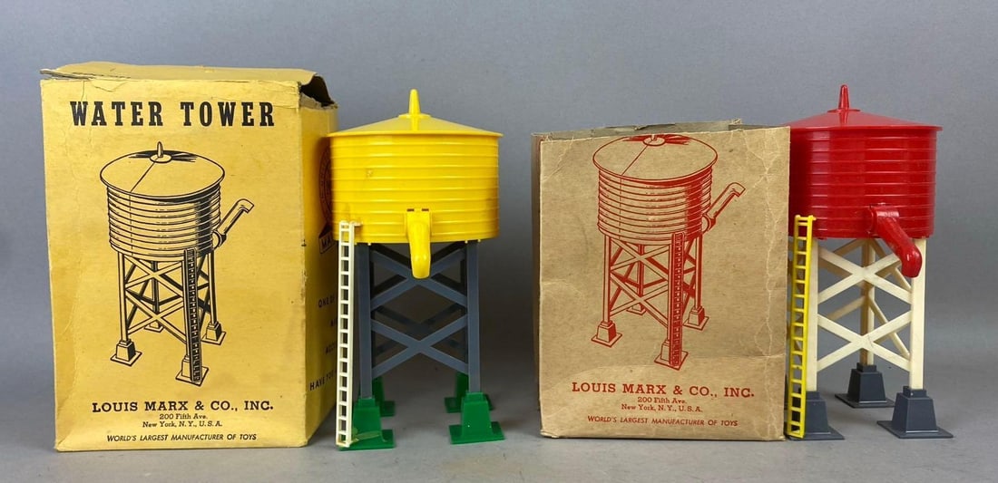 Group of 2 Marx No.065 Water Towers Buildings: Like new in original packaging. Packaging has rips and tears. Measures 8 inches tall.