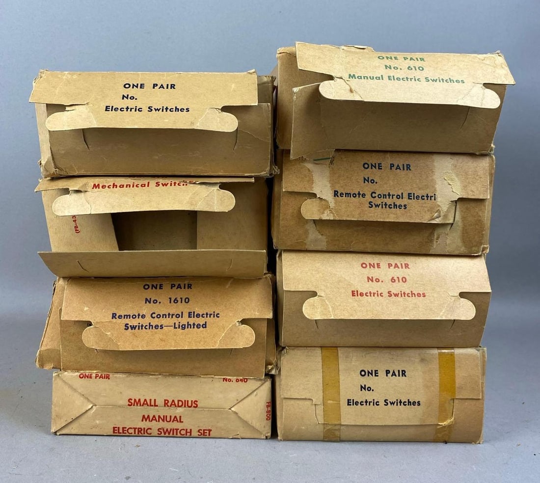 Group of 8 1950s Marx Electric Switch Sets: Like new in original packaging. Packaging has rips and tears.largest measures 12 inches in length.