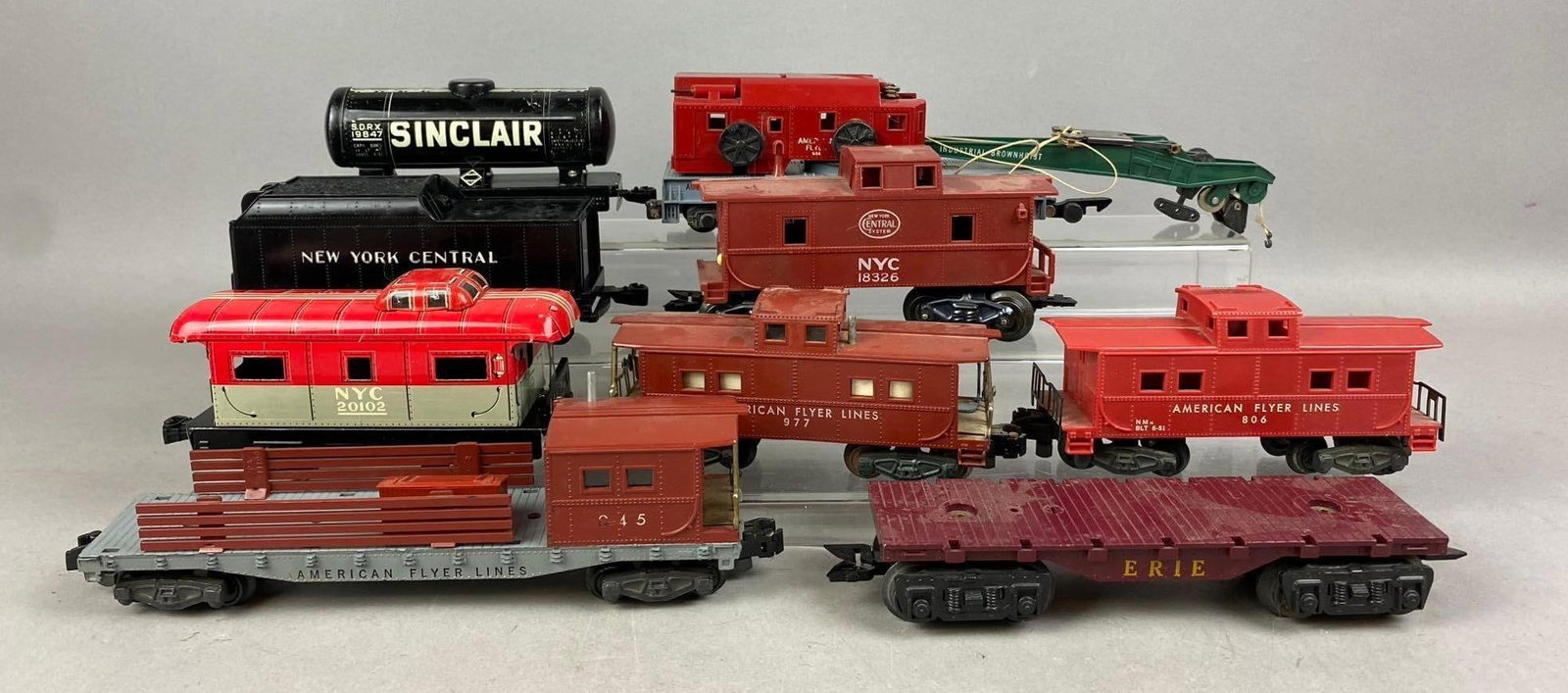 Group of Assorted 1950s American Flyer S Gauge Train Cars: Largest measures 10 inches in length. Stand not included.