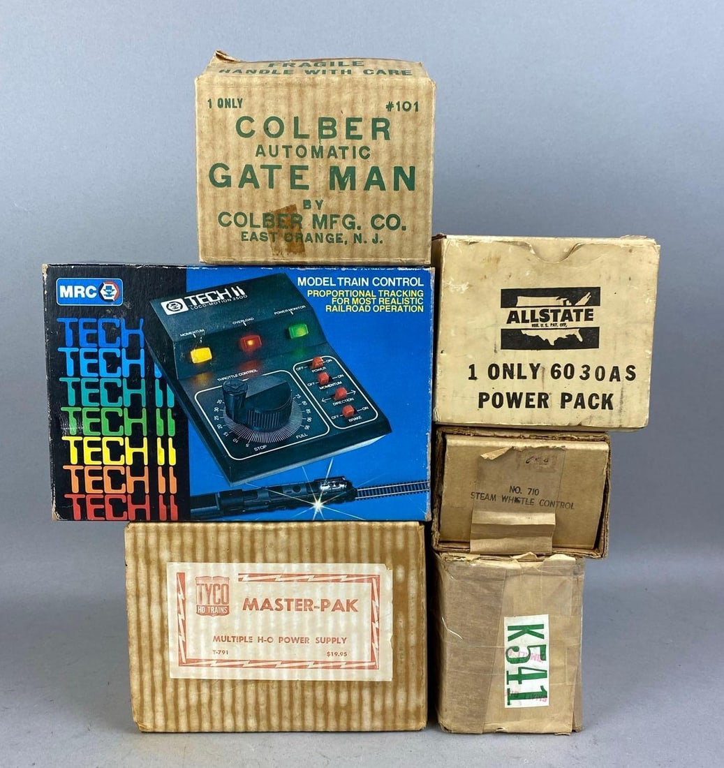 Group of Assorted HO Scale Power Packs and More: Includes train Control, Gateman, and more. Large measure 5 inches in length.