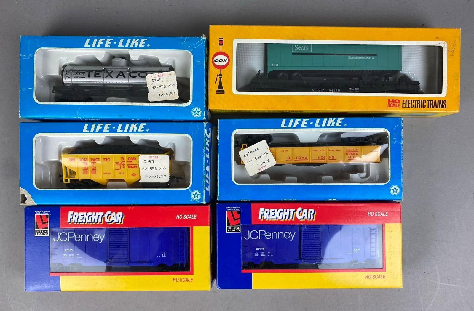 Group of 6 Life Like Trains HO Scale Train Cars: Includes JC Penny, Sears, and more Advertising. Largest measures 10 inches in length.