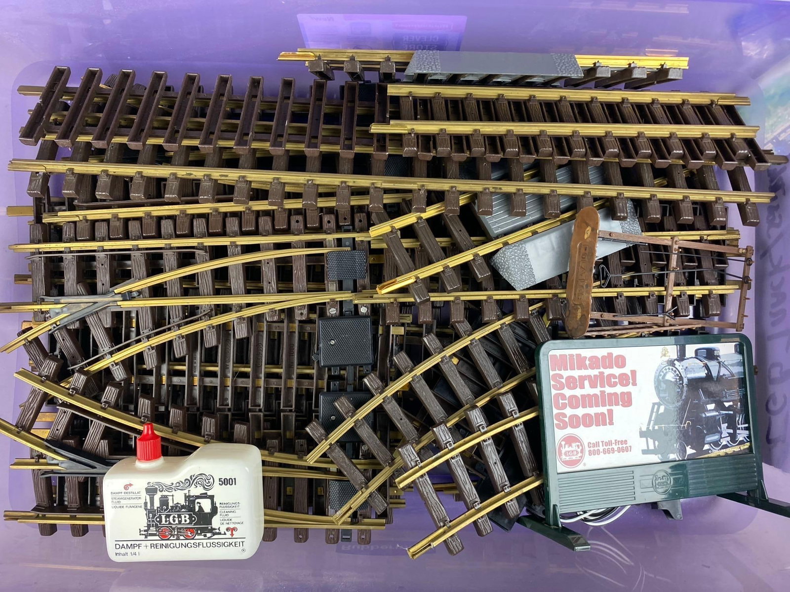 Group of Assorted German LGB G Scale Tracks and Accessories: Largest measures 10 inches long. Includes cleaning fluid, wires, and more.