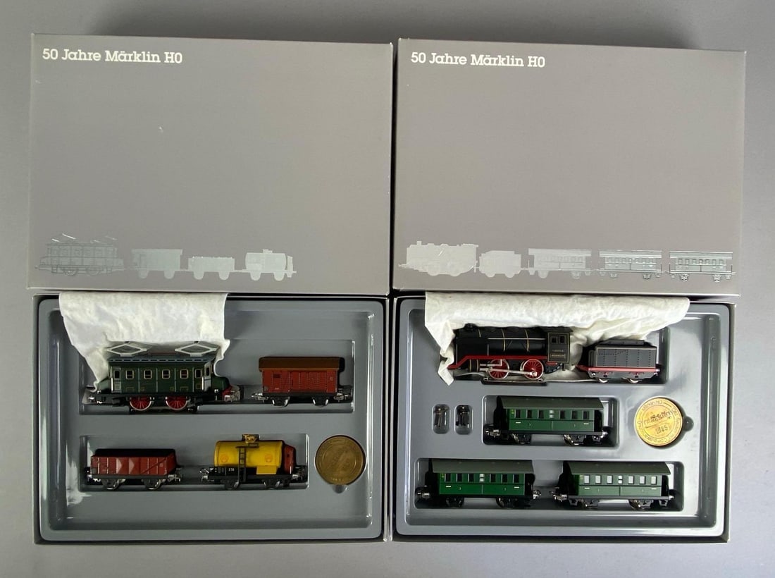 Marklin HO Scale 50 Year Anniversary Train Set: in original box, includes steam locomotives, figurines, train cars and more, box measures 10 inches H x 27 1/2 inches W x 2 1/2 inches D