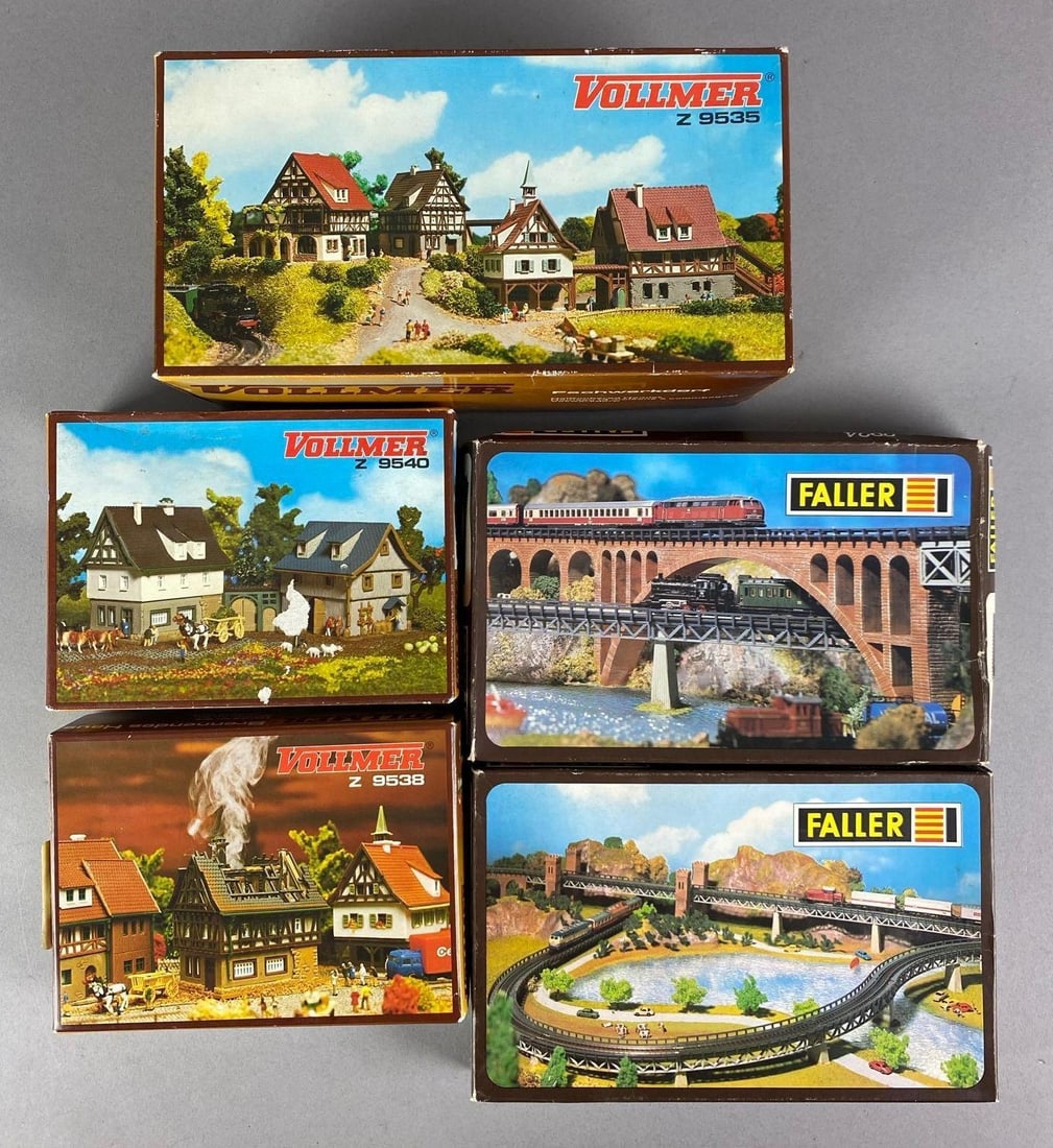 Group of Vollimer and Faller Model Train Accessories: in original boxes, includes stone arch bridge, pier set, house on fire and more, largest box measures 5 inches H x 9 1/2 inches W x 3 1/2 inches D