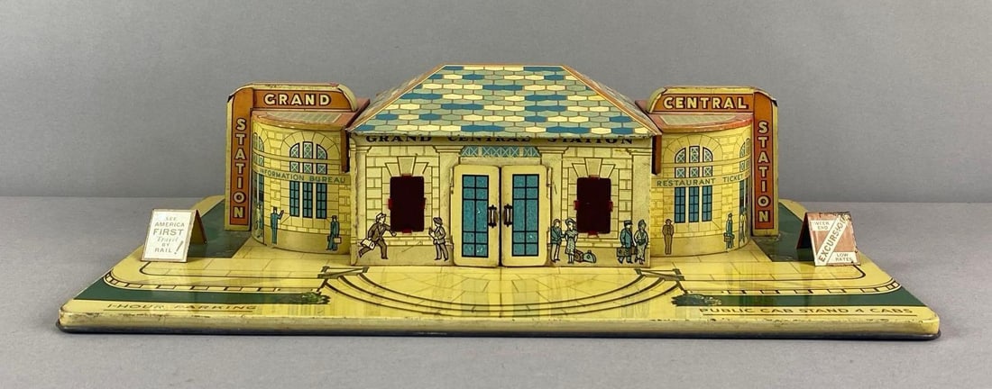 Vintage Marx Tin-Litho Grand Central Station Building: Some paint wear and dents, measures 5 inches H x 17 inches W x 11 inches D