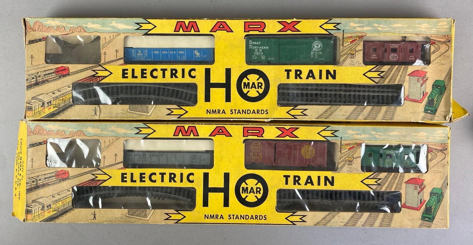 Group of 2 Vintage Marx HO Scale Electric Train Start Sets: in original boxes, each missing the steam locomotive. Each measures 6 1/2 inches H x 22 inches W x 2 inches D