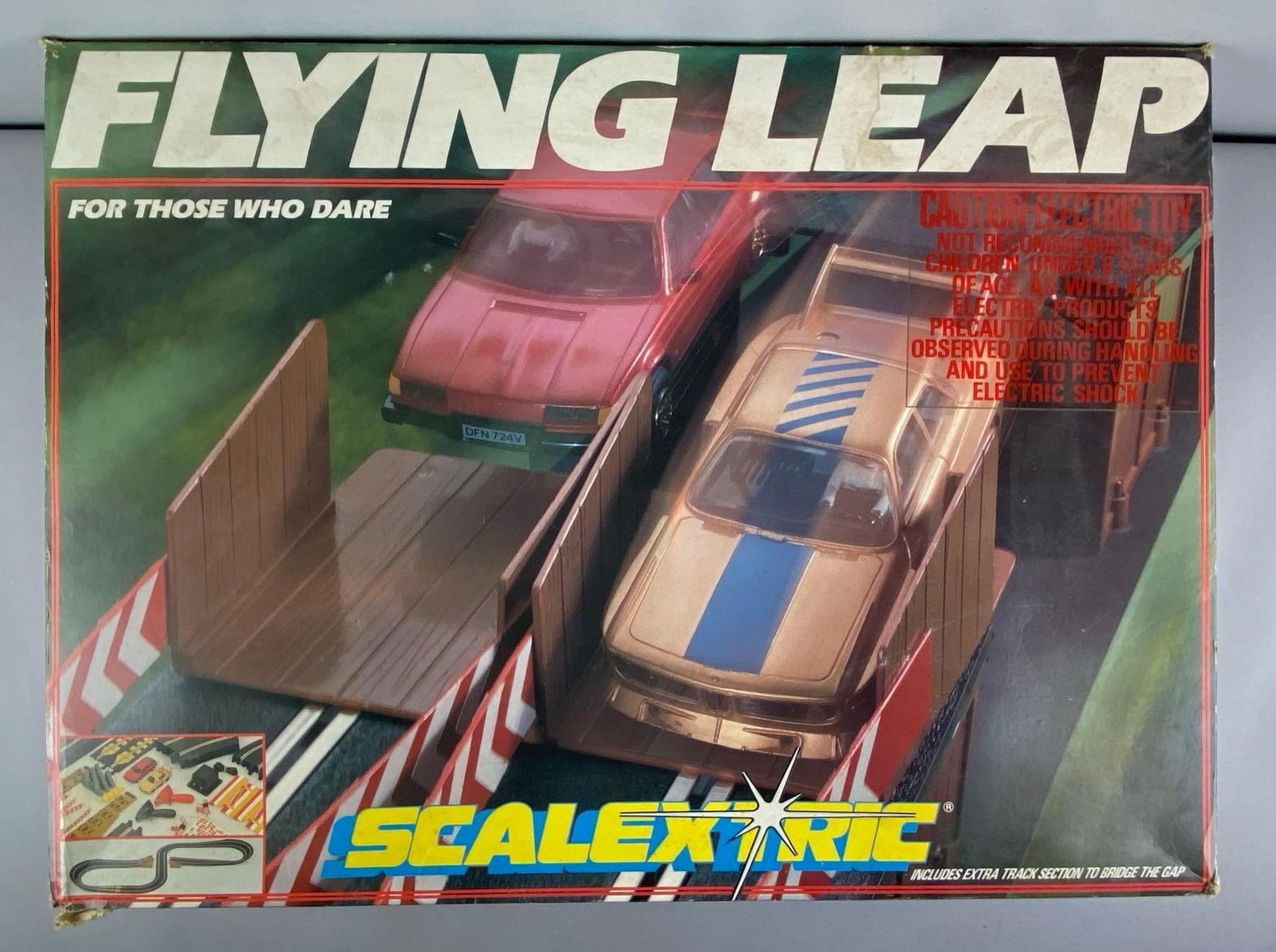 1980s Hornby Scalextric Flying Leap Slot Car Track Set: untested in original box, set seems complete with original slot cars, shelf wear shown, box measures 23 inches H x 31 inches W x 5 inches D