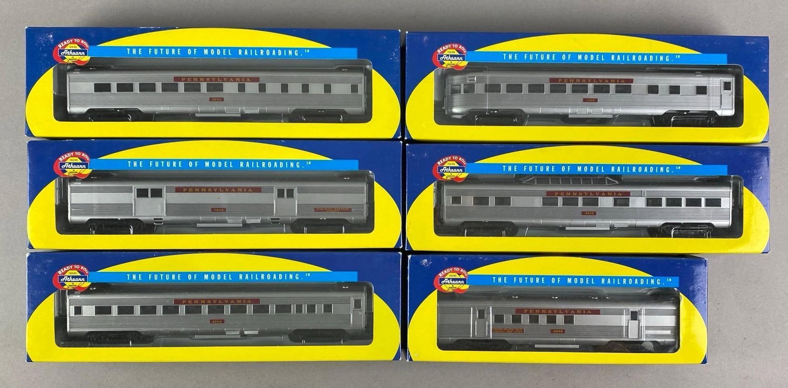 Group of 6 Athearn HO Scale Pennsylvania Passenger Train Cars: In original boxes, inclufes vista dome, RPO, Diner and more, largest each measure 12 1/2 inches W