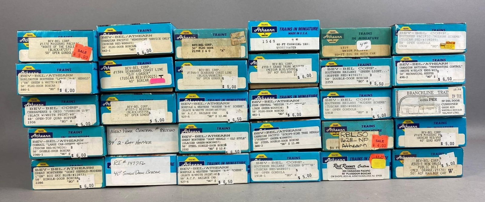 Group of 10+ Athearn HO Scale Train Cars: Includes Chemical Tank, Boxcar, and more. One Box measures L 8 x W 4 inches.