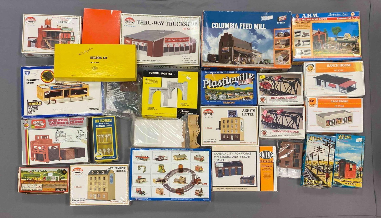 Group of Assorted HO Scale Model Train Building Plastic Model Kits: Most sealed, otherwise sets seem complete, inclufes thru-way truck stop, railroad hotel, columbia feed mill and more