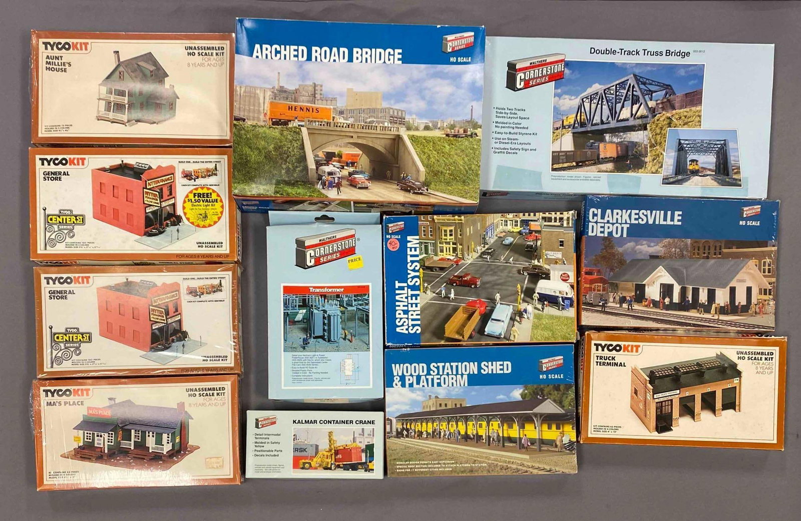 Group of Assorted HO Scale Model Train Building Plastic Model Kits: Most sealed, includes truck terminal, double track truss bridge, transformer and more
