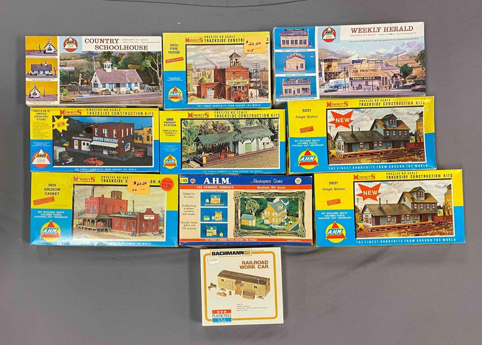 Group of 10 Assorted HO Scale Model Train Building Plastic Model Kits: some sealed, includes freight station, trackside construction site, country school house and more, largest measured 7 inches H x 13 1/2 inches W
