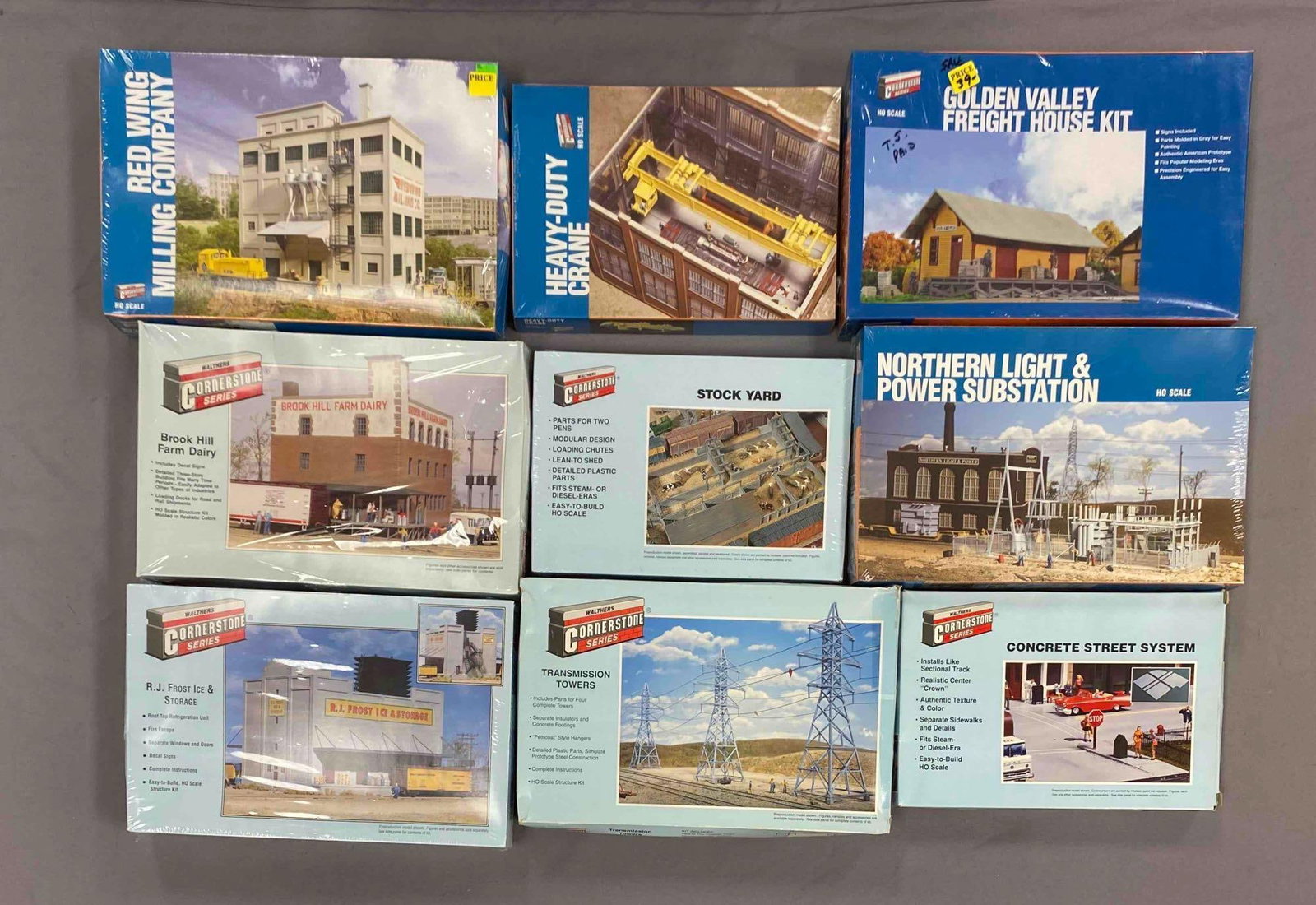 Group of Walthers Cornerstone HO Scale Model Train Building Plastic Model Kits: Most sealed, includes Concrete street system, transmission towers, North light and Power substation and more, largest measures 9 inches H x 14 inches W