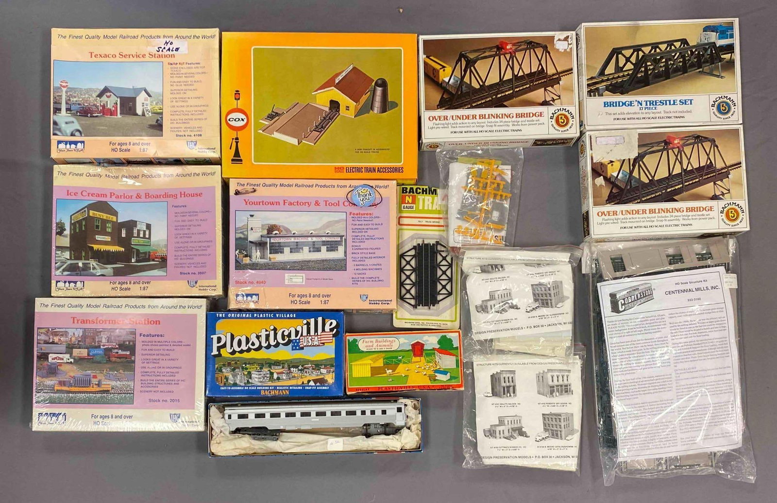 Group of Assorted HO Scale Model Train Building Plastic Model Kits and More: Most sealed, includes transformer station, model train passenger car, yourtown factory and tool company snd more, largest measures 10 inches H x 13 inches W