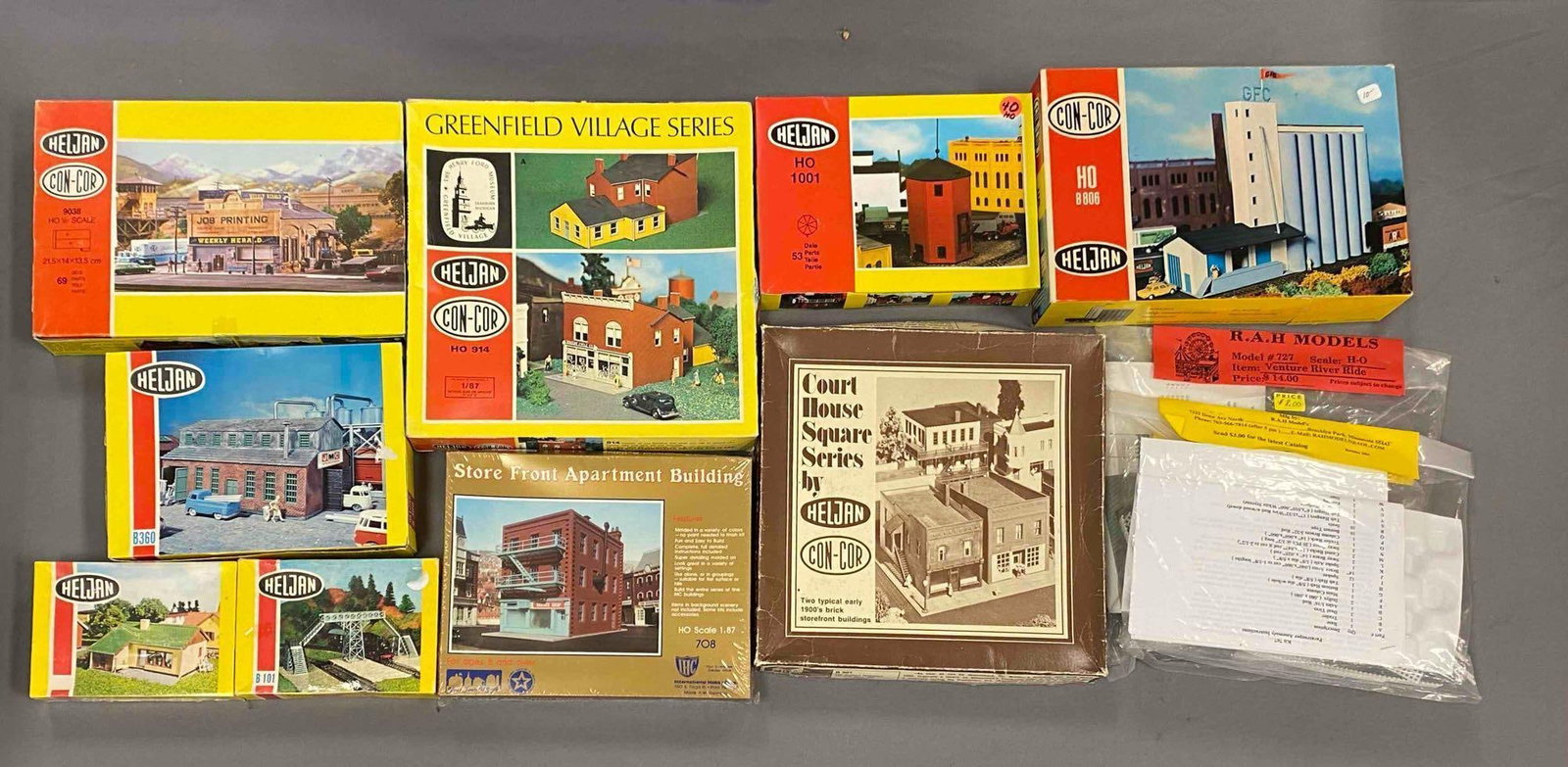 Group of Assorted HO Scale Model Train Building Plastic Model Kits and More: Some sealed, includes greenfield village, Korn Silo, Gangbro foot bridge and more, largest measures 12 inches W x 12 inches W