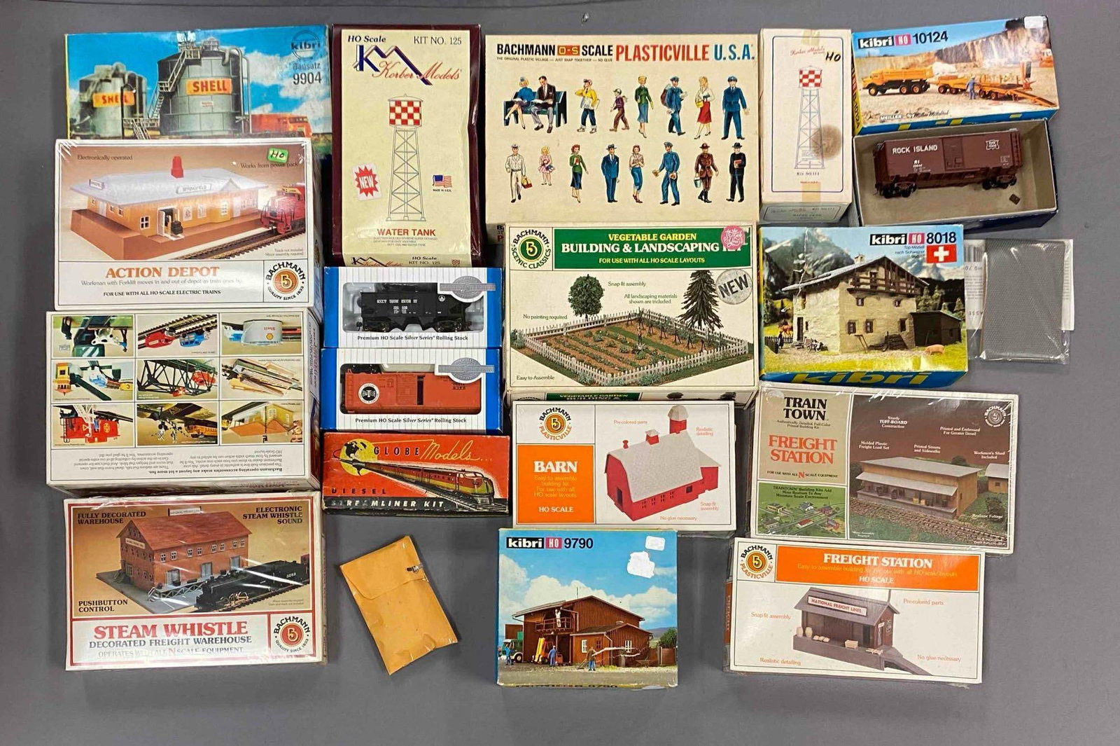 Group of Assorted HO Scale Model Train Building Plastic Model Kits and More: Some sealed, includes steam whistle warehouse, freight station, various train box cars and more, largest measures 7 inches H x 10 inches W