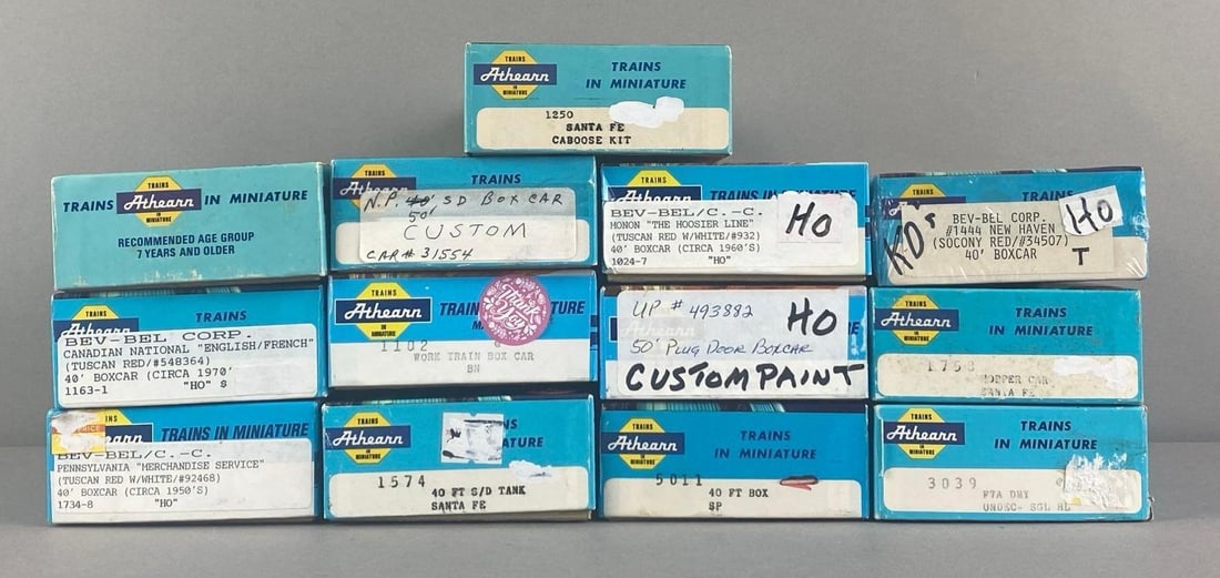 Group of Assorted Athearn HO Scale Train Cars: includes Hoppers Bev Bel Boxcar, santa fe caboose diesel locomotive and more, each box measures 7 3/4 inches W