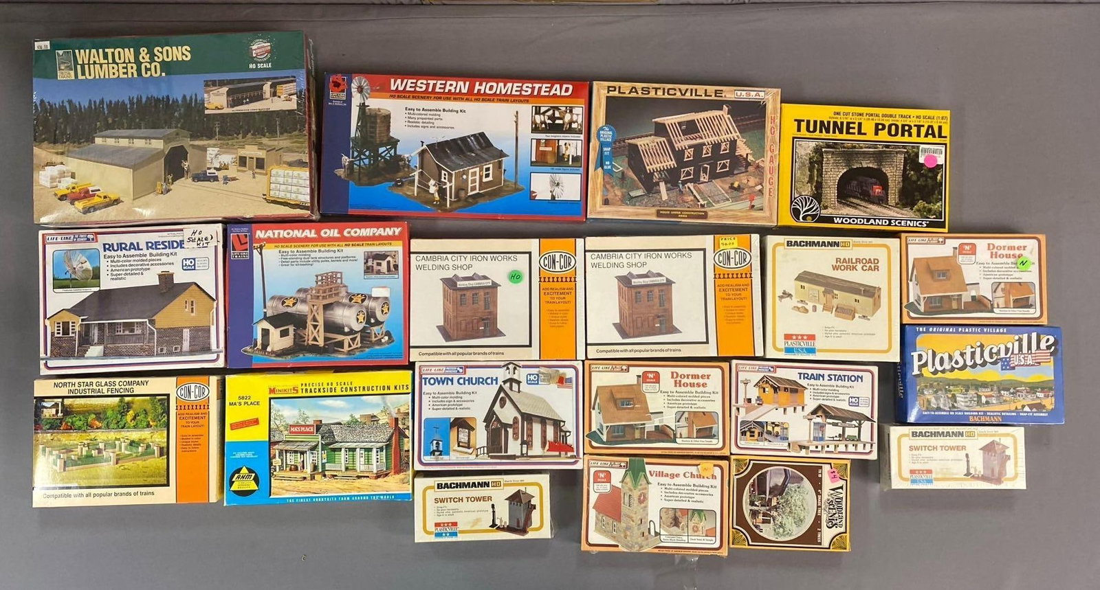 Group of 10+ Life-Like HO Scale Buildings and More: Include church, tower, and more. Largest measures L 15 x W 12 inches.