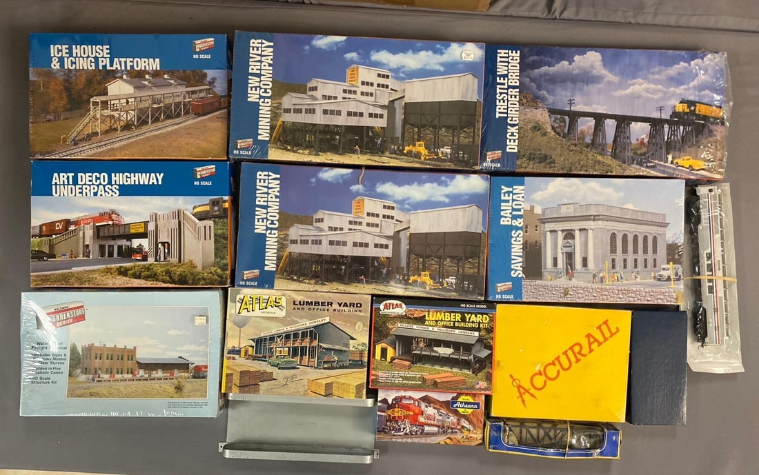 Group of 10+ Walthers Cornerstone HO Scale Buildings and More: Includes Lumber yard, bank, and more. Largest measures L 17 x W 9 inches.
