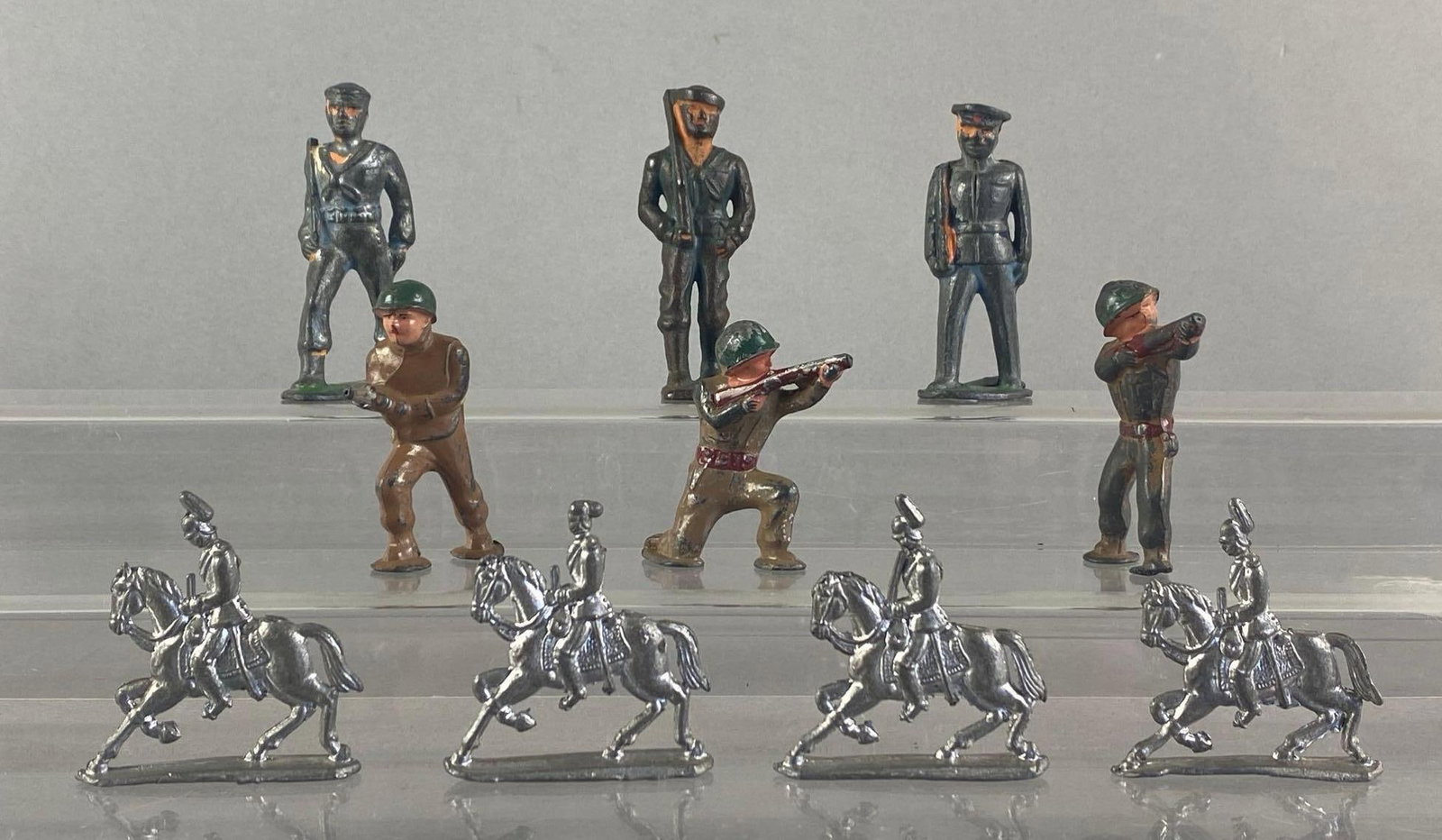 Group of 10 Vintage Cast Metal Toy Soldiers: Paint wear throughout, tallest measures 3 inches H