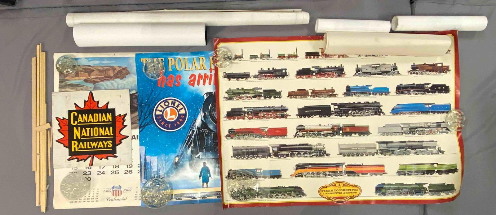 Group of Train Related Posters and More: Includes the polar express, 1969 Union pacific calendar, Canadian National railways sign and more, largest shown measures 27 inches H x 39 inches W