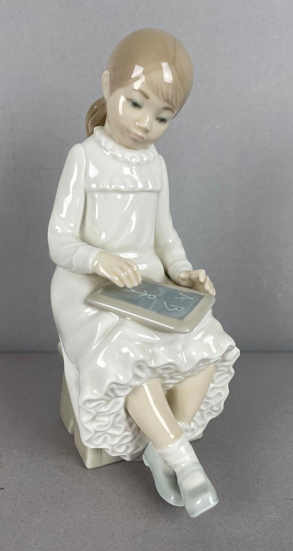 NAO Lladro School Girl with Slate Porcelain Figurine: Measures 7 1/2 inches tall