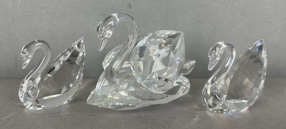 Group of 3 Swarovski Crystal Faceted Swan Figurines: Largest measures 2 inches x 3 inches x 1 3/4 inches