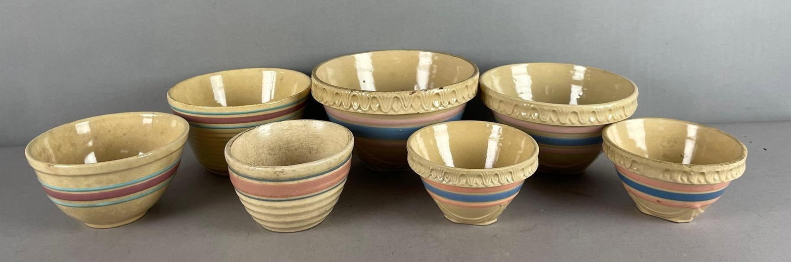 Group of Vintage Striped Yelloware Nesting Bowls: Includes McCoy, watt, largest measures 5 inches x 8 1/2 inches