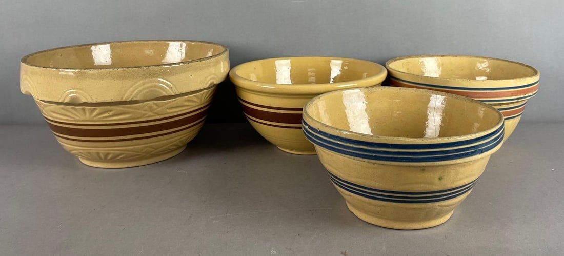 Group of Vintage Striped Yelloware Mixing Bowls: Some hairline cracks, largest measures 6 1/2 inches x 12 inches
