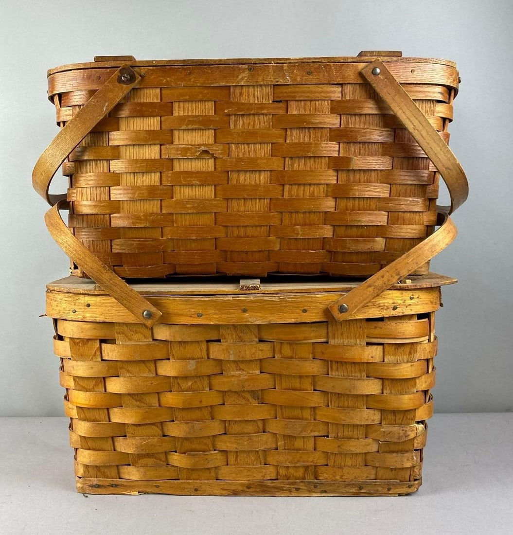 Group of 2 Antique 1930s Wicker Picnic Baskets: Largest measures H 10 x W 10 x L 19 inches.