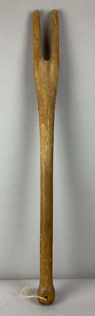 Primitive Wood Washing Stick: Measures 28 inches in length.