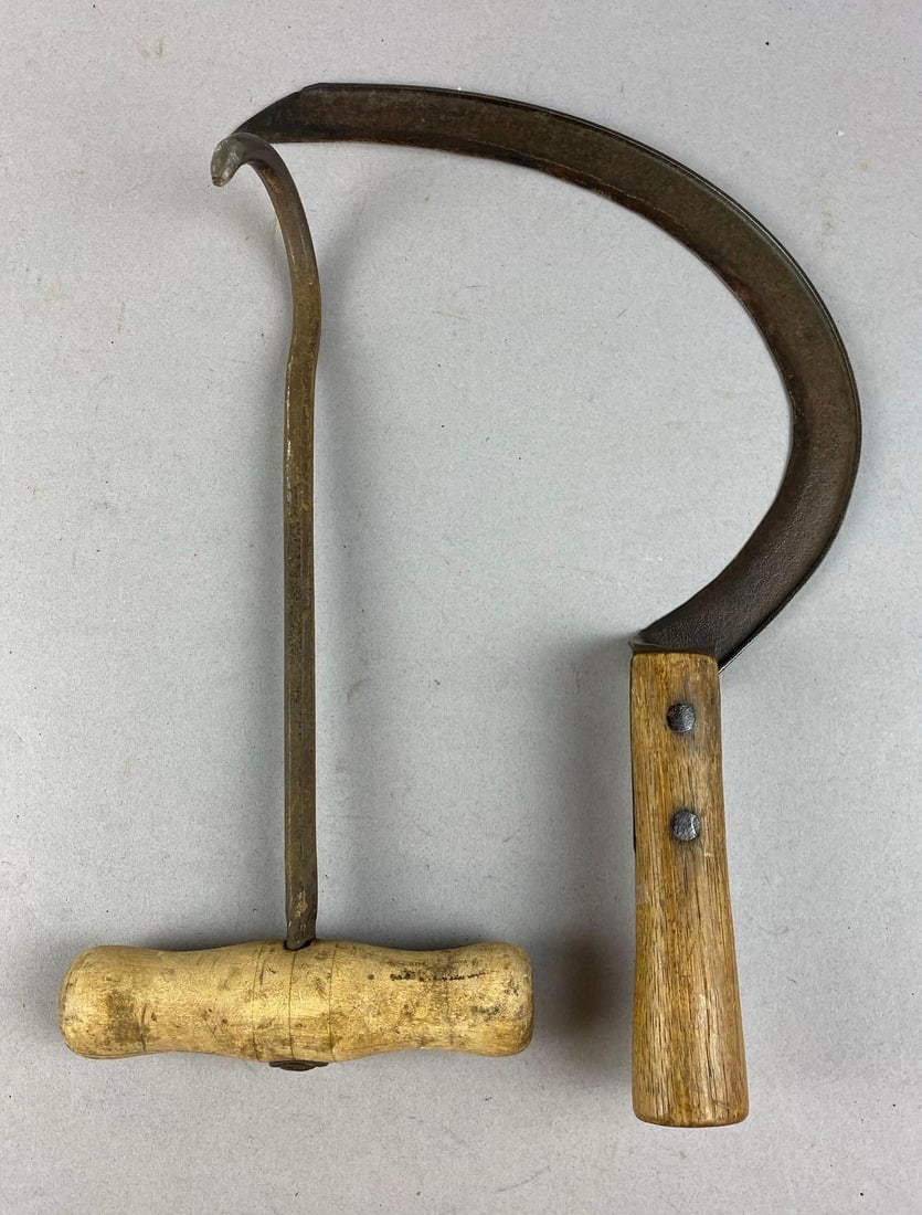 Group of 2 Primitive Farming Tools: Includes Sickle and hay hook. Largest measures 12 inches long.