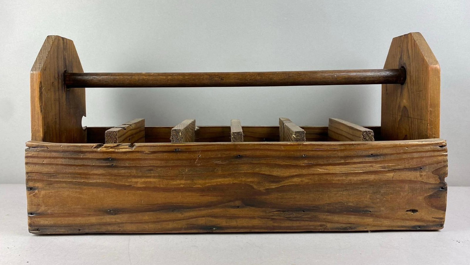 Antique Wood 6-Compartments Carpenter Tool Caddy: Measures H 13 x W 9 1/2 x L 26 inches.