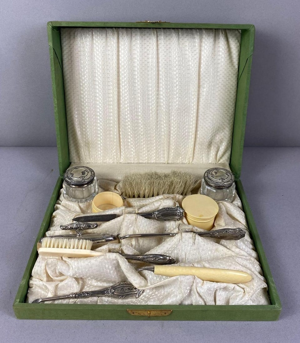 Antique Cased Victorian Sterling Silver and Celluloid Vanity Grooming Set: Circa 1880s. Measures H 3 x W 8 1/2 x L 10 1/2 inches.