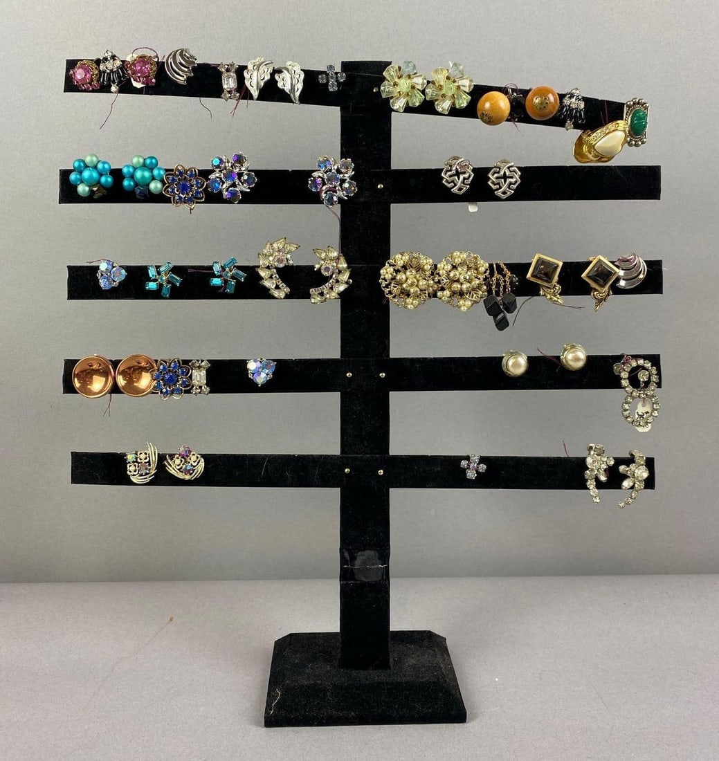 Group of 10+ Pair of Costume Jewelry Earrings: Includes copper tone, wood, and more. Display stand included.