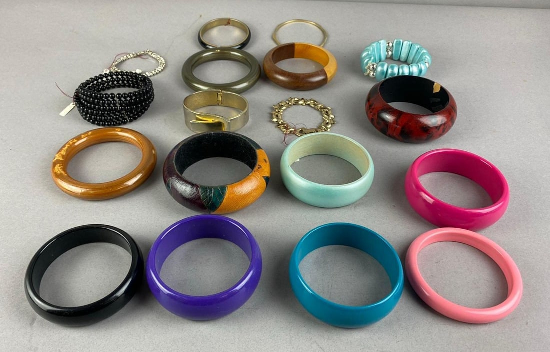 Group of Assorted Costume Jewelry Bracelets: Includes various Colors. Largest measures 2 inches in diameter.