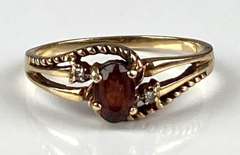 Signed 10K Yellow Gold Garnet Diamond Ring: Total weight of 2.1 grams, size 8 1/2