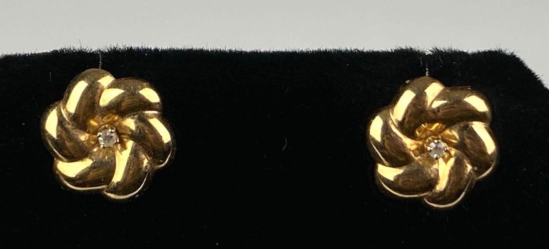 Pair of 14K Yellow Gold White Sapphire Floral Stud Earrings: Total weight of 0.8 grams, each measures 1/2 inches H
