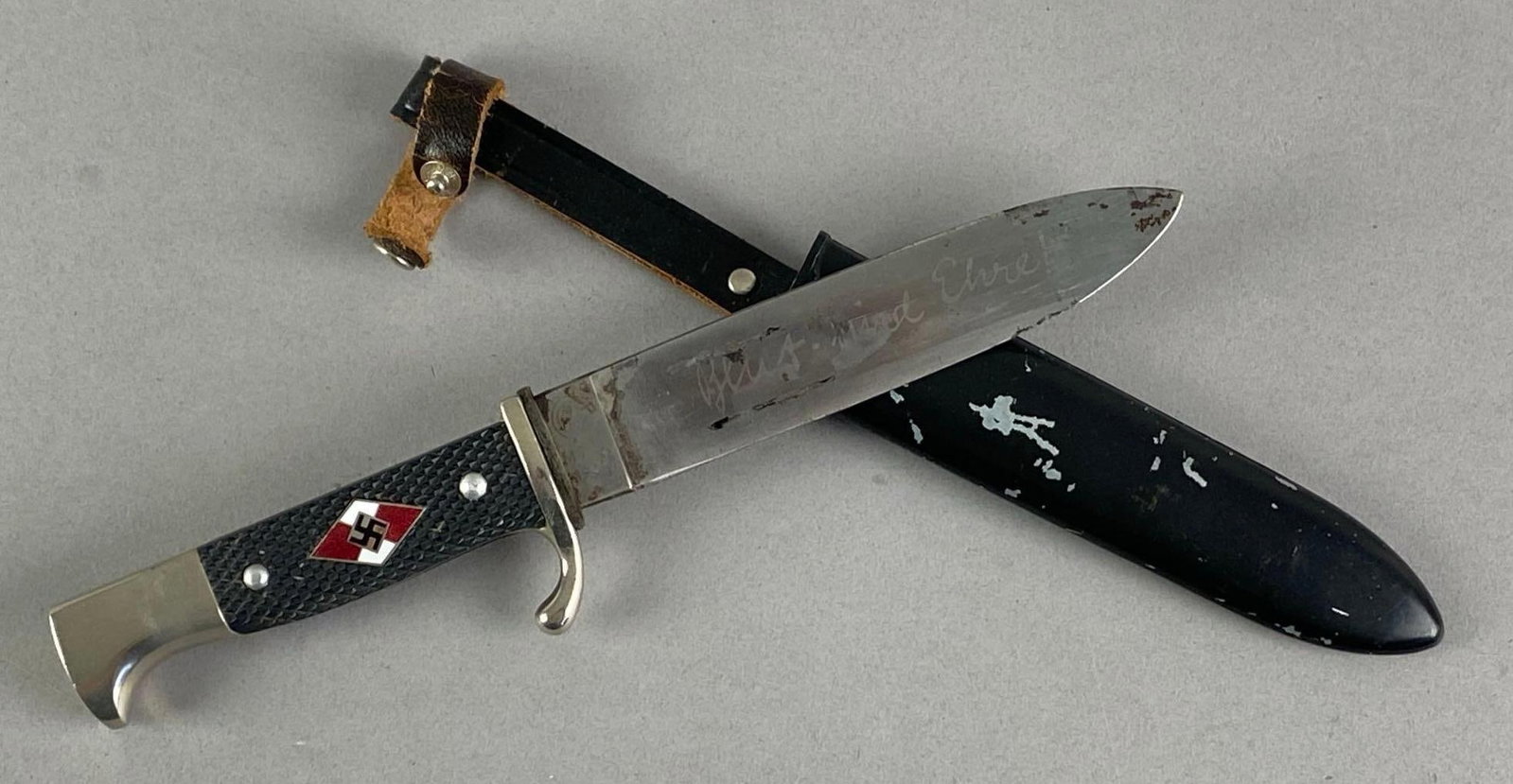 German Hitler Youth Fixed Blade Knife with Scabbard: Features Blood and Honor engraving on blade in german, wear shown on scabbard and blade, Measures 9 1/2 inches L with a 5 inches blade