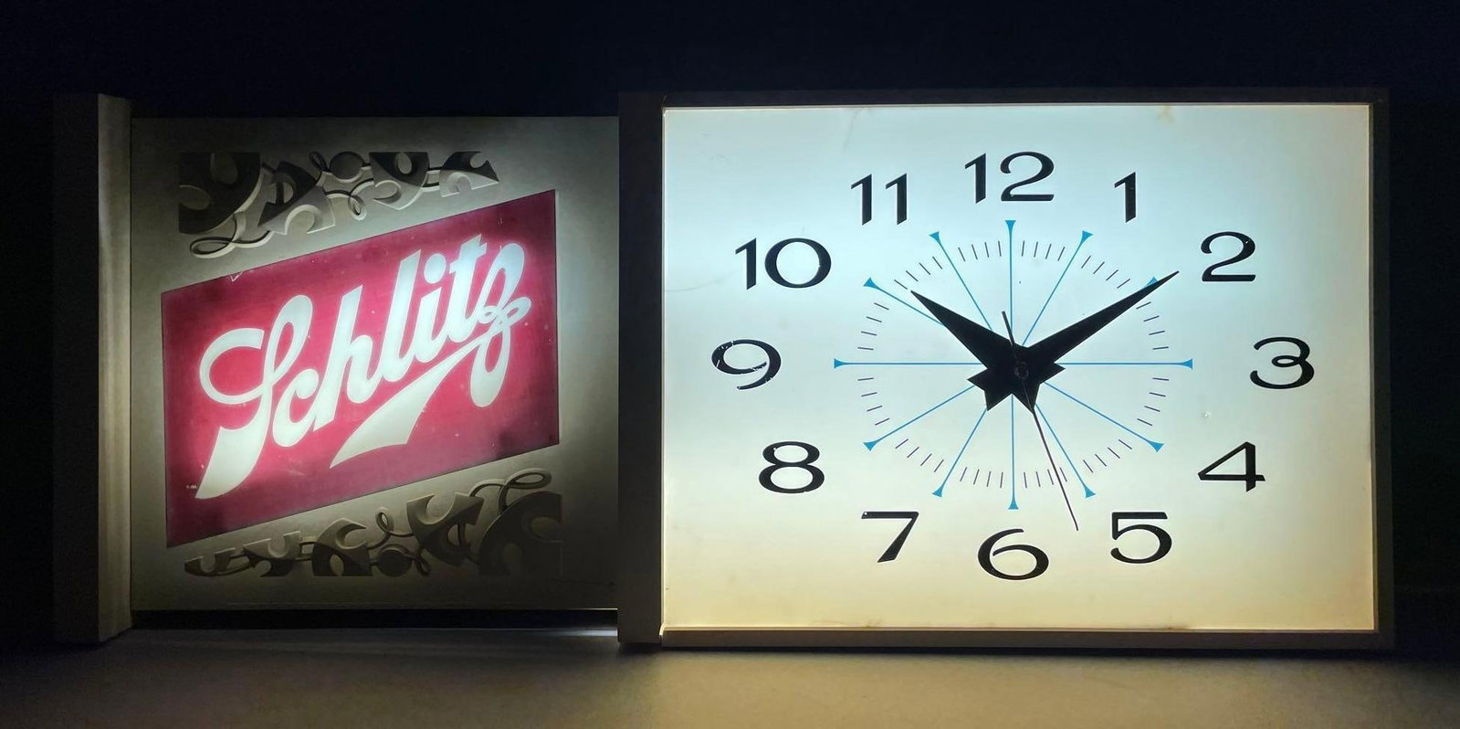 Vintage Schlitz Beer Light-Up Advertising Clock: Working light, clock did not work in test, measures 15 inches x 36 inches x 5 inches