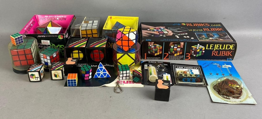 Group of Assorted Vintage 1980s Rubik Cubes and More: Includes Alexander Star, Pyramid, and more. Largest measures L 11 x W 6 inches.