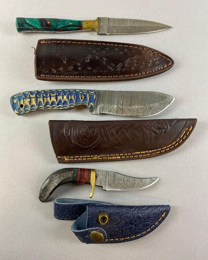 Group of 3 Custom Damascus Steel Fixed Blade Knives: Includes handmade leather sheath. Longest measures 8 inches total length, 4 inches blade length.