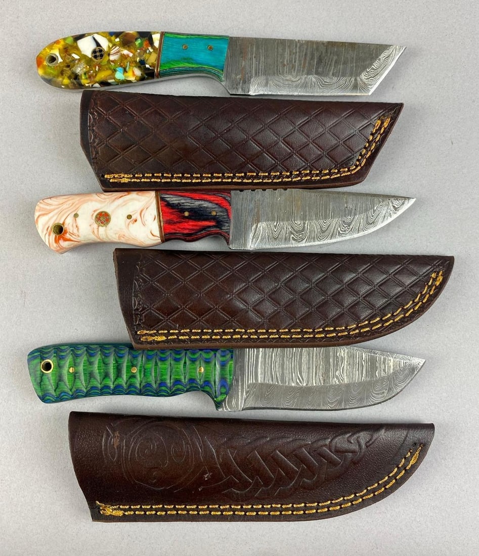 Group of 3 Custom Damascus Steel Fixed Blade Knives: Includes handmade leather sheaths. Largest measures 8 inches total length. 4 inches blade length.