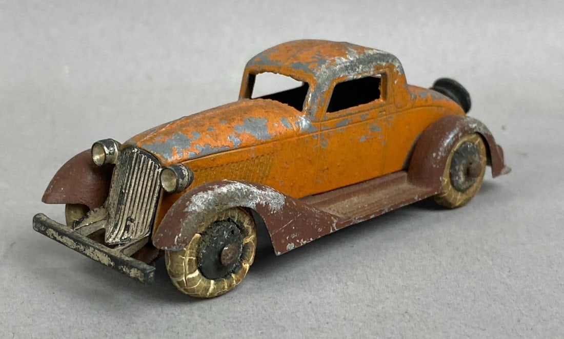 Antique 1930s Tootsie Toy Graham 5 Wheel Coupe Die-Cast Vehicle: Missing trunk tire. Other tires have crack in wheels. Measures 3 inches in length.