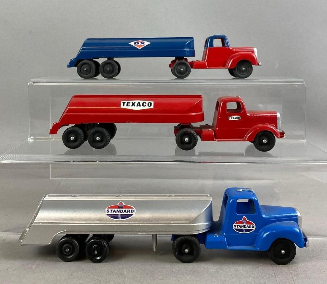 Group of 3 Vintage 1950s Tootsietoy Custom Painted Oil Tankers Die-Cast Vehicles: Includes DX, Texaco, and Standard. Stand not included. One measures 9 inches in length.