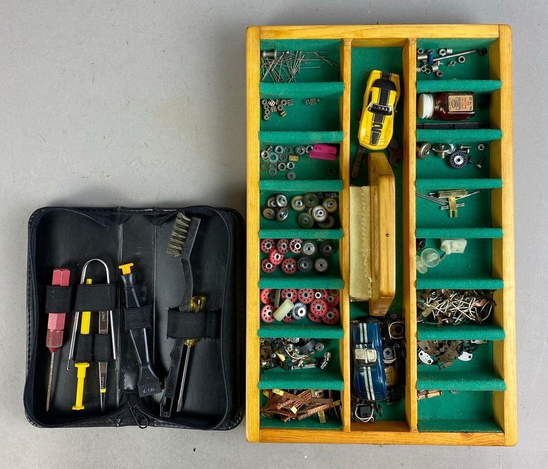 Group of Assorted Slot Car Replacement Parts and More: Includes tool kit. Case measures H 2 x W 9 x L 15 inches.