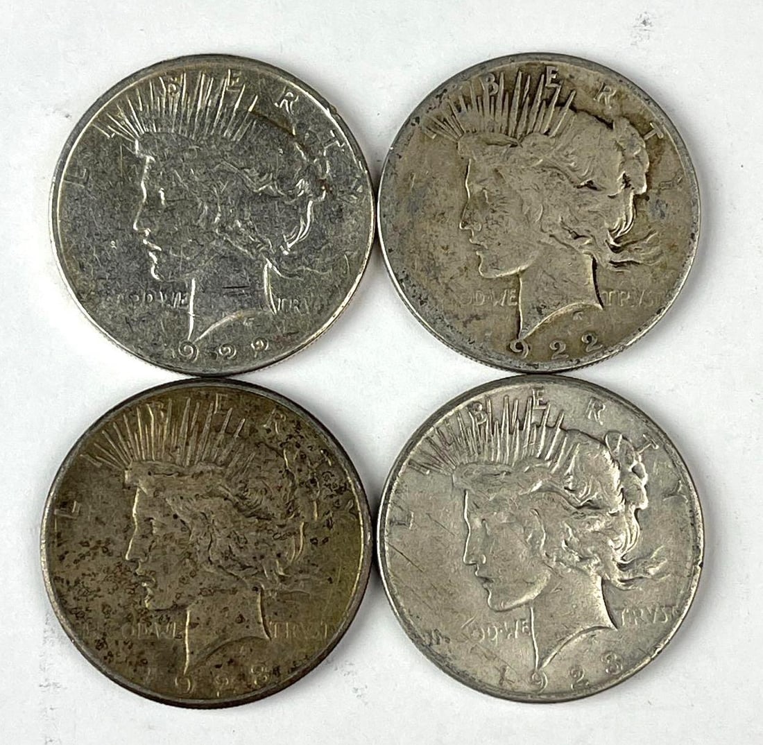 Group of 4 US Peace Silver Dollars: Includes years 2 1922 S and 2 1923 S.