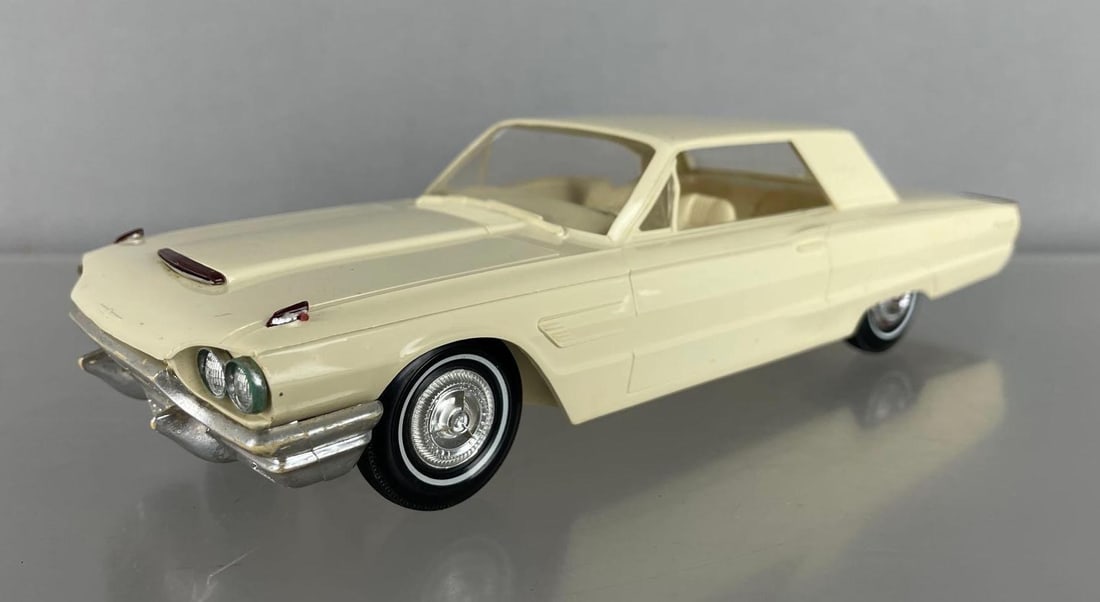 1965 Ford Thunderbird Hardtop Dealership Promo Car: Wimbledon white, loose front passenger headlights, rub on front chrome